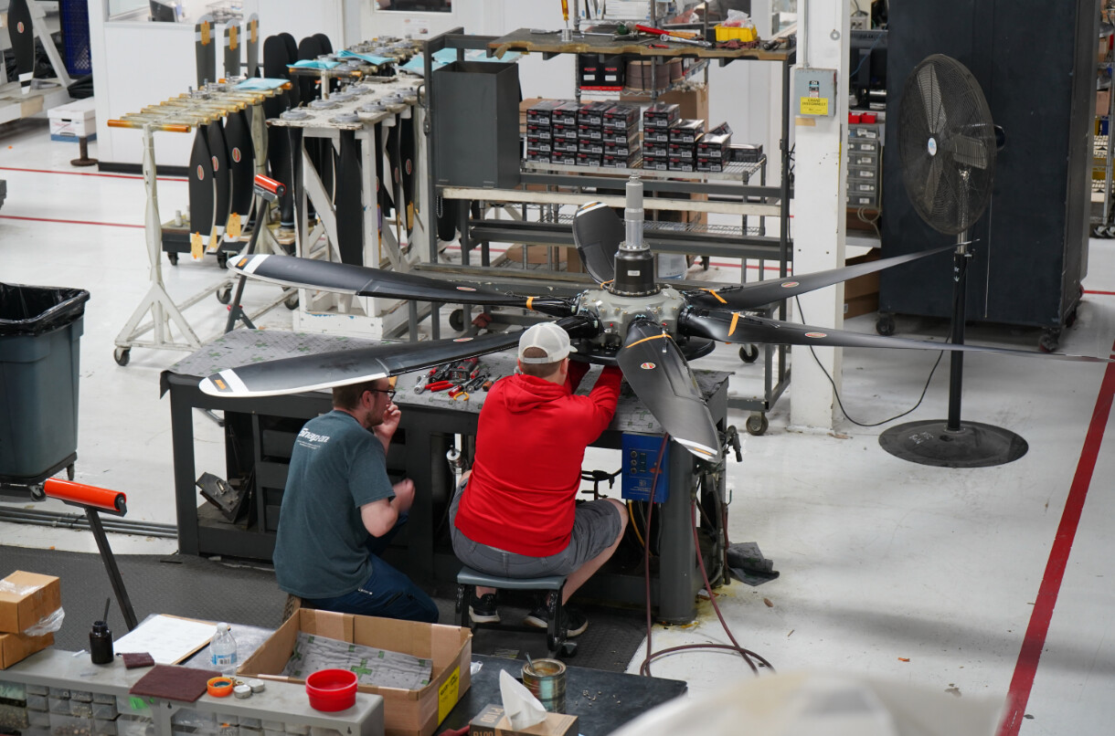 Two Hartzell Propeller technicians repairing a propeller