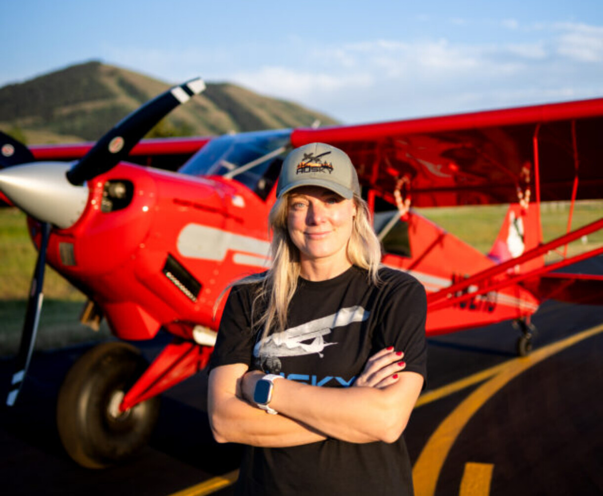 Annie Vogel posing next to a Hartzell Propeller on his aircraft
