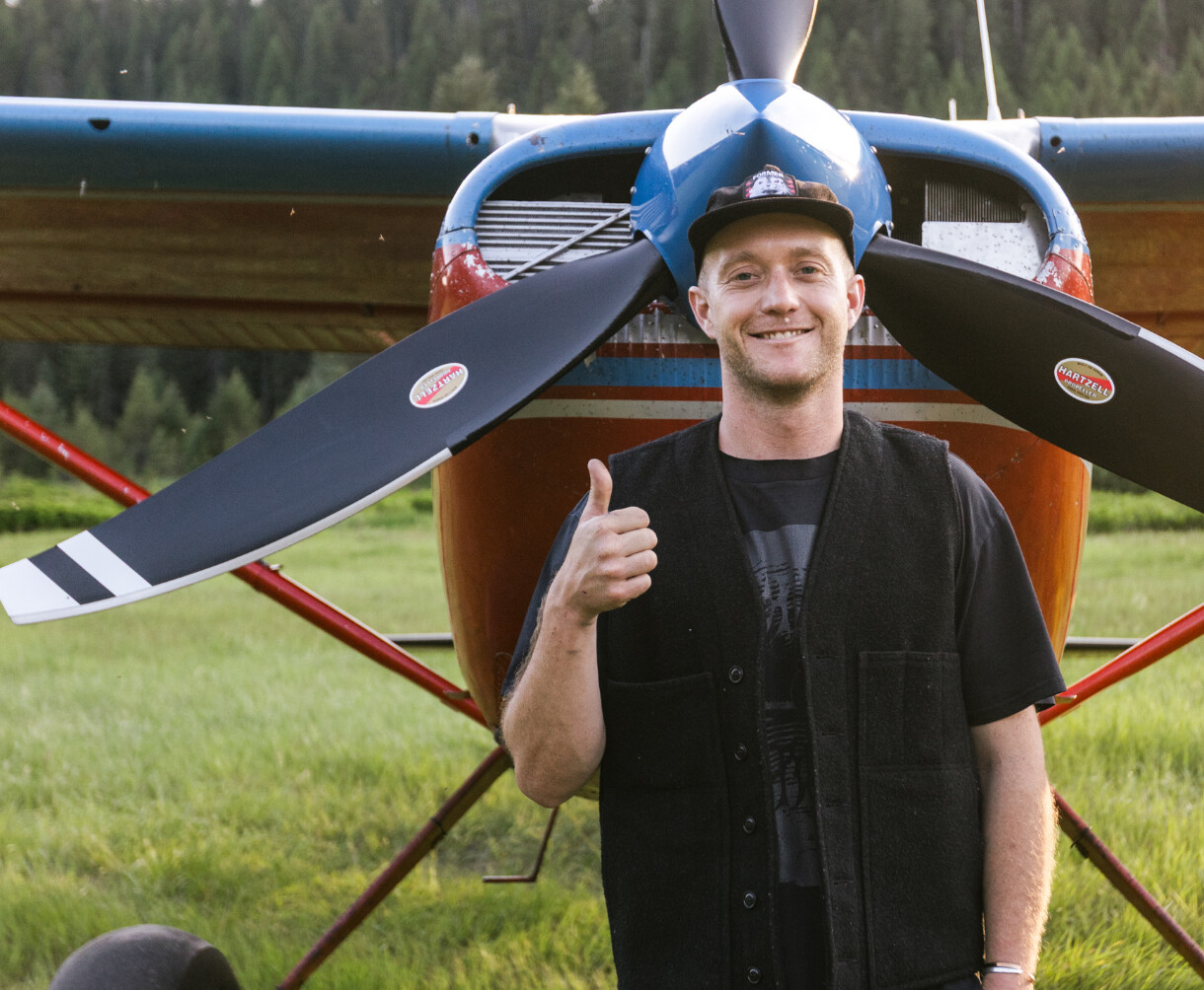 Essex Prescott posing next to a Hartzell Propeller on his aircraft